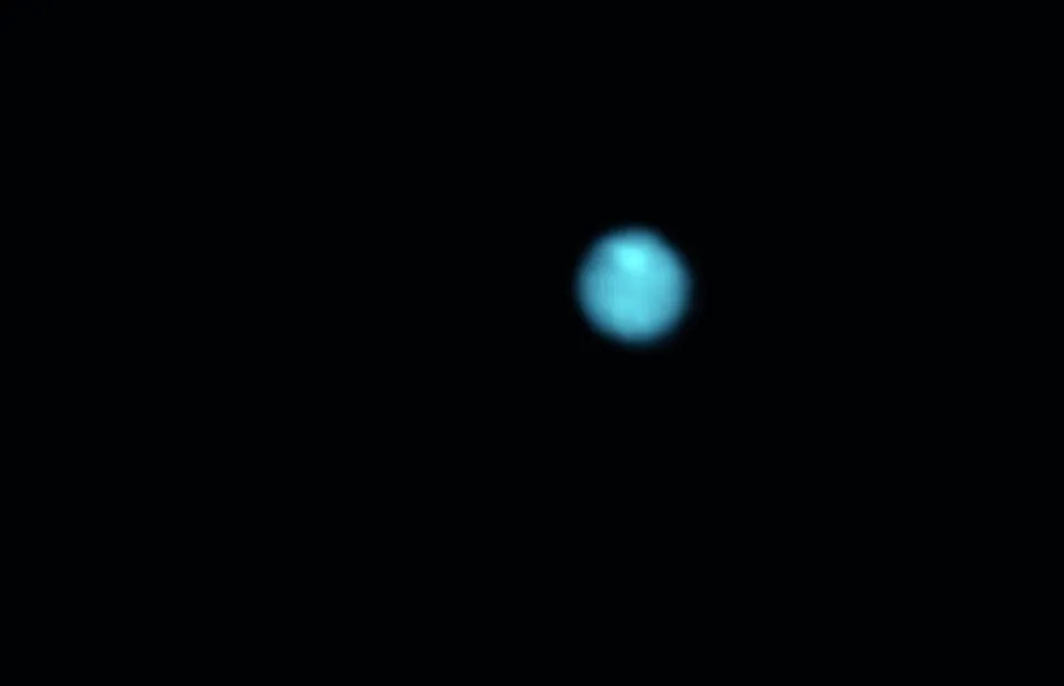 Neptune (colourised for aesthetic reasons) imaged in late 2017 with a ZWO ASI290MM and 610nm IR filter. Below it is Triton, which was exposed separately. Credit: Martin Lewis