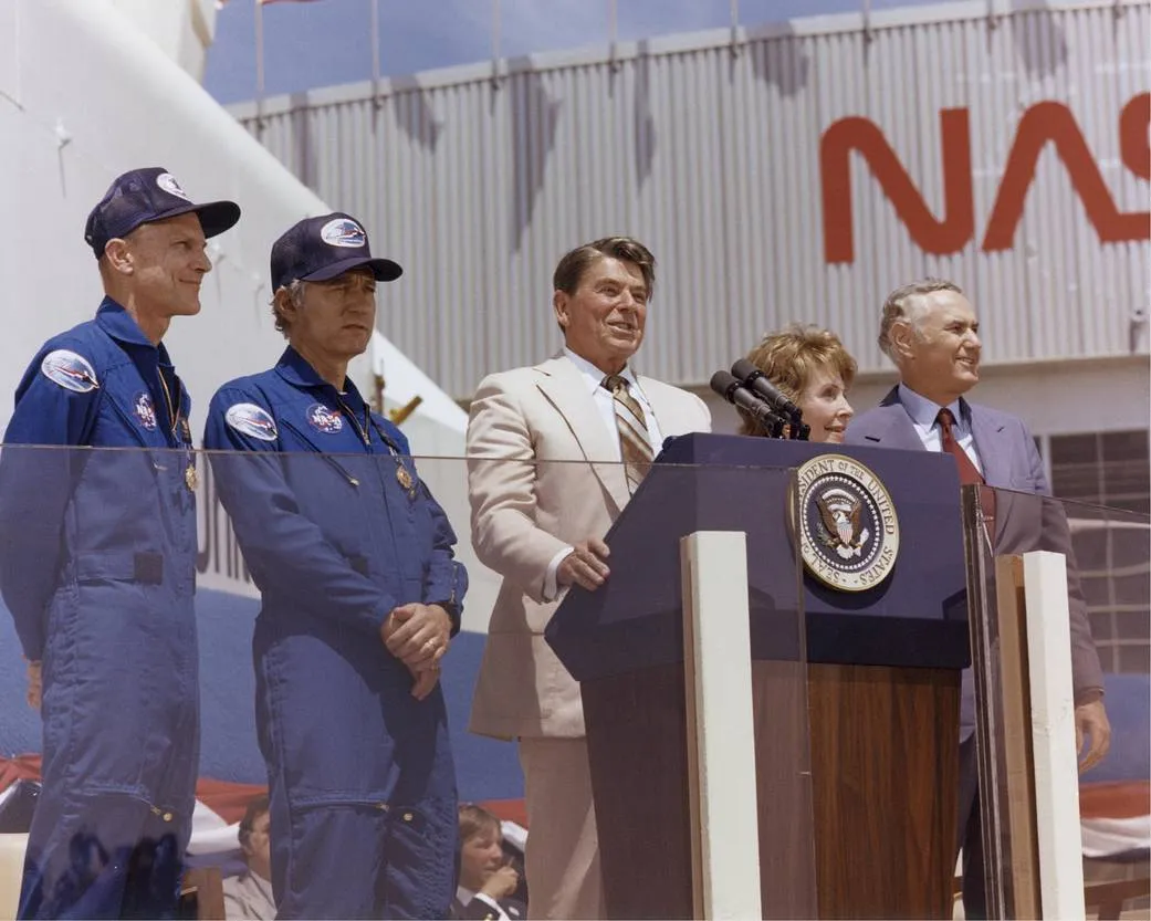 US President Ronald Reagan address a crowd at NASA's Dryden Flight Research Center following the landing of Columbia's STS-4 mission, 4 July 1982. To Reagan's left are STS-4 astronauts Thomas K. Mattingly and Henry W. Hartsfield. Credit: NASA