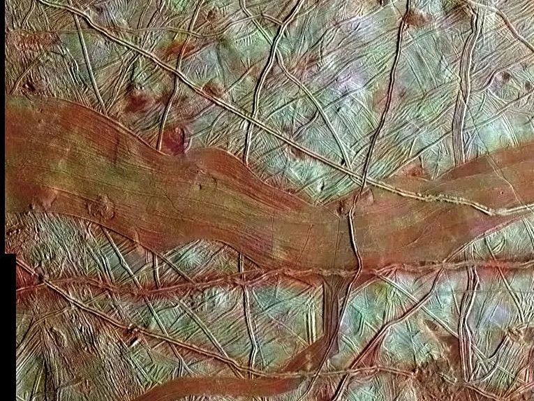 A view of Jupiter's icy moon Europa, as seen by the Galileo spacecraft. Blue-white areas indicate relatively pure water ice, while red represents areas of water ice mixes with hydrated salts. Credit: NASA/JPL-Caltech/SETI Institute
