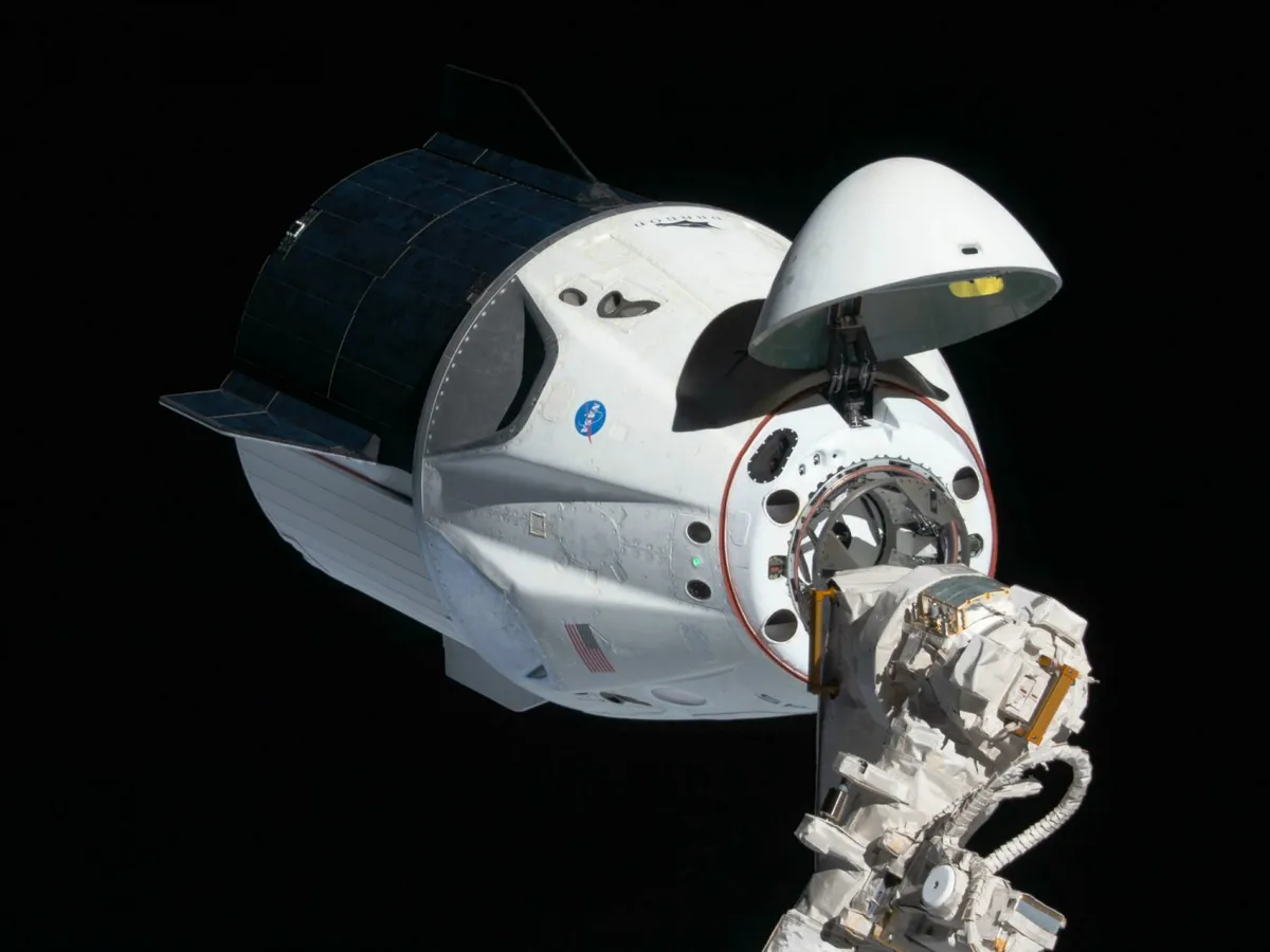 The uncrewed SpaceX Crew Dragon approaching the International Space Station. Crew Dragon is the first commercial crew vehicle to service the ISS Credit: NASA.