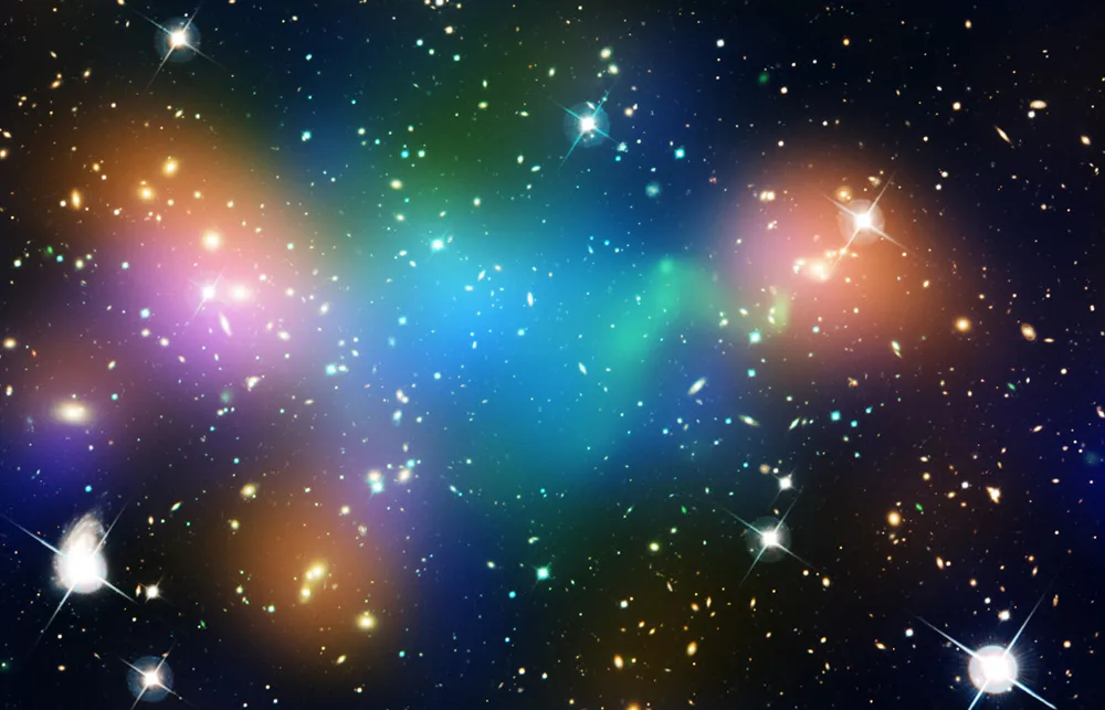 Hubble and Chandra X-ray Observatory image showing dark matter and hot gas in merging galaxy cluster Abell 520. Green is hot gas; blue areas are the location of most of the mass in the cluster, which is dominated by dark matter. NASA, ESA, CFHT, CXO, M.J. Jee (University of California, Davis), and A. Mahdavi (San Francisco State University).
