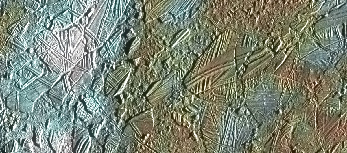 Galileo's view of a thin ice crust in the Conamara region of the moon Europa. White and blue regions are areas covered in fine ice particles. Credit: NASA/JPL/University of Arizona