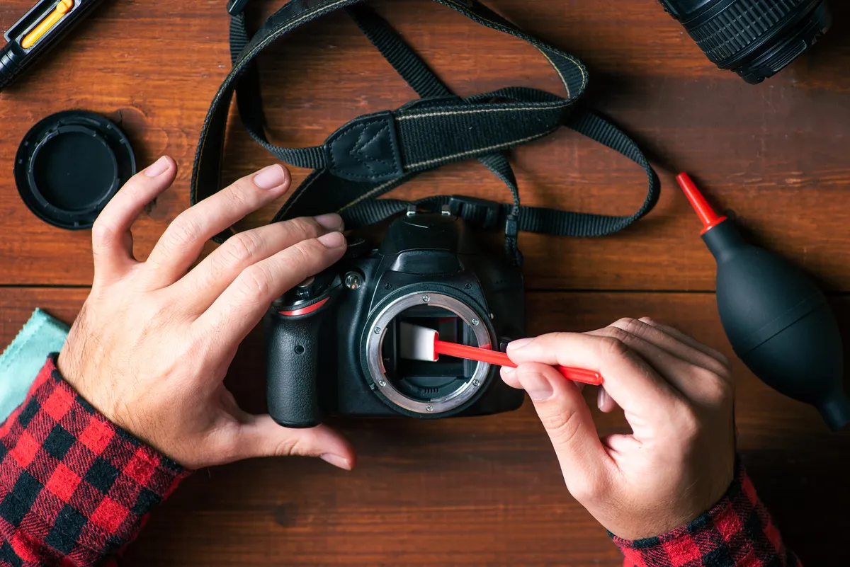 Keeping your DSLR sensor clean will keep your images free of dust specks. Credit: Stefan Tomic / Getty Images