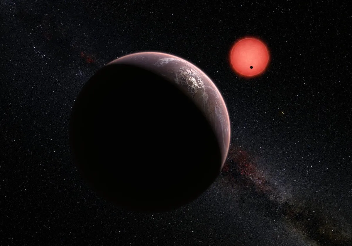 An artist’s impression showing an imagined view of the exoplanets within the TRAPPIST-1 system, 40 lightyears from Earth. Credit: NASA