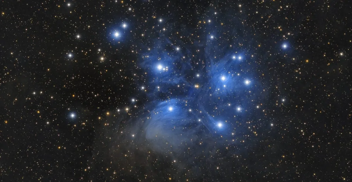 The Pleiades can be found by tracing the three stars of Orion's belt and following the line they create to find what appears as a 'smudge' in the night sky. Credit: Tommy Nawratil / CCDGuide.com