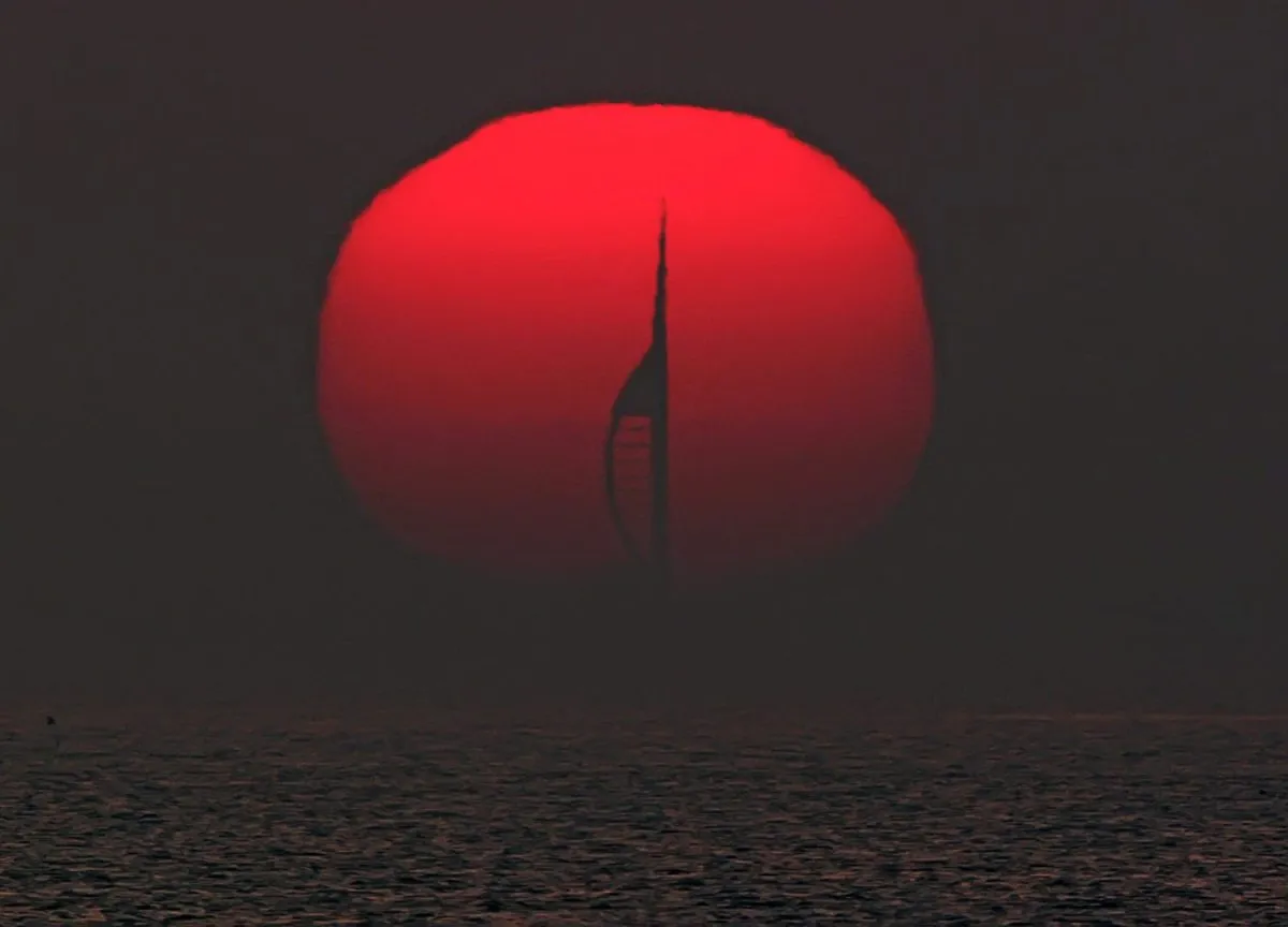 Portsmouth’s Spinnaker Tower, silhouetted by the setting Sun – taken from 22km away. Credit: Pete Lawrence