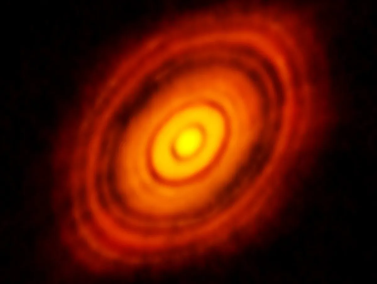 An image of a protoplanetary or accretion disk around star HL Tauri. The dark rings could indicate newly-forming planets in orbit, pushing aside dust as they go. Credit: ALMA (ESO/NAOJ/NRAO)