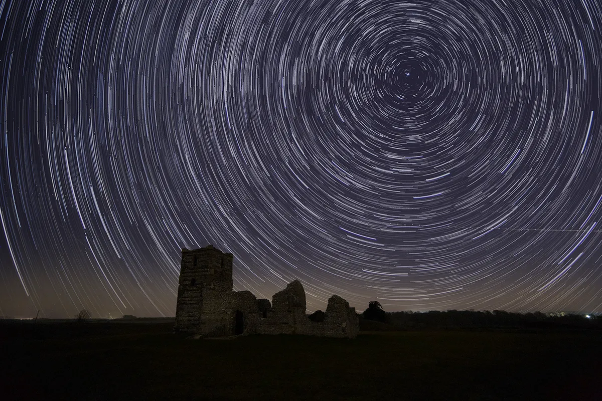 Star trails above Knowlton Church, Cranborne Chase AONB, Dorset. Copyright: Paul Howell at Pictor Images