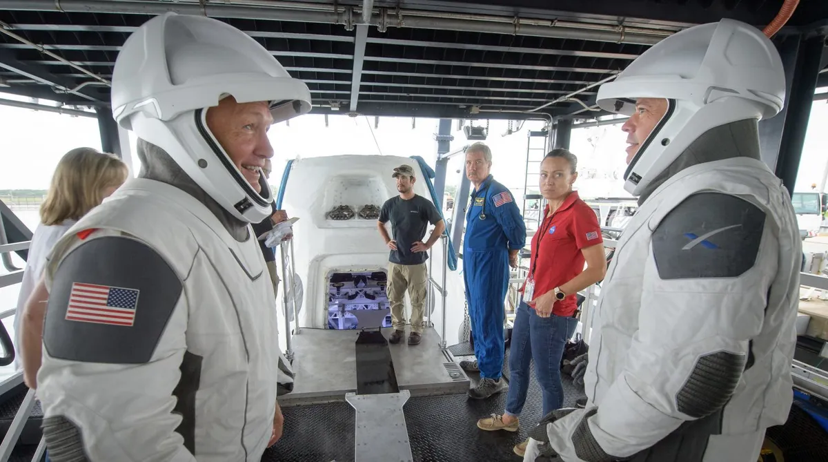 NASA astronauts Doug Hurley (left) and Bob Behnken during crew extraction rehearsals from the SpaceX Crew Dragon, 13 August 2019 at Cape Canaveral, Florida. Credit: (NASA/Bill Ingalls)