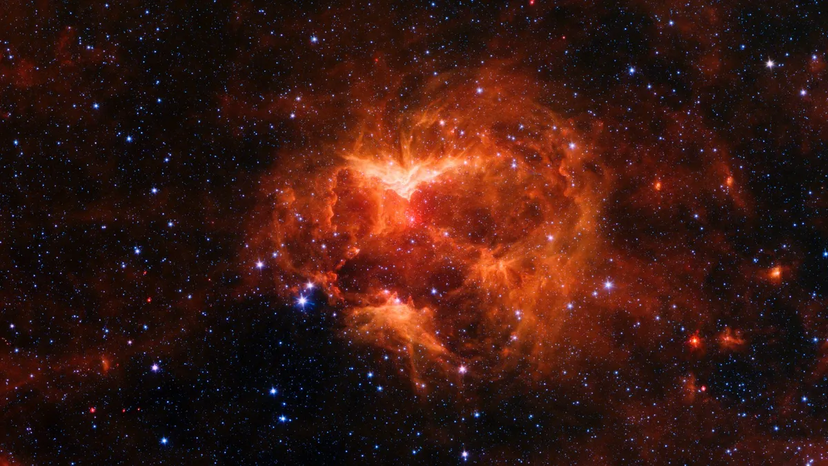 Jack-o’-Lantern Nebula This nebula features powerful outflows of radiation and particles from a star 15-20 times more massive than our Sun. Credit:NASA/JPL-Caltech