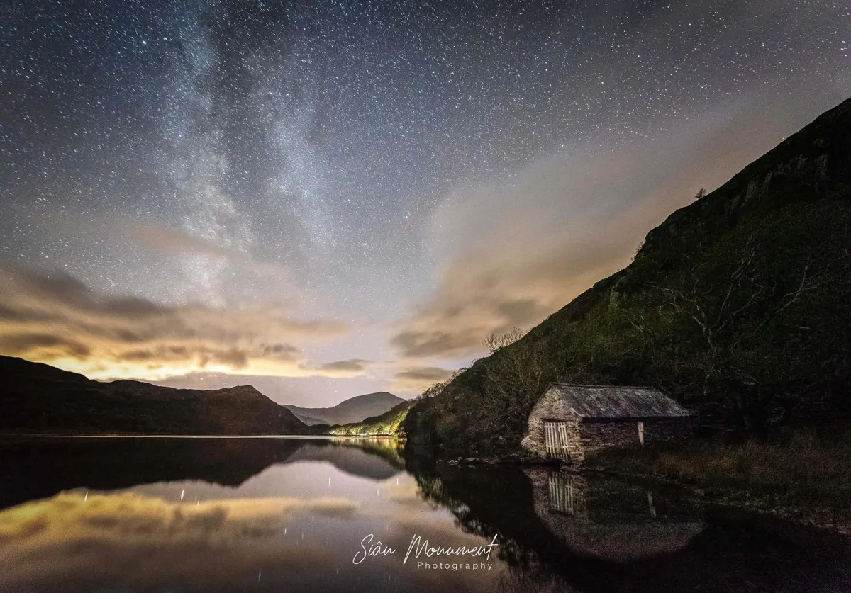A view of the starry night sky and the Milky Way over Snowdonia. Credit: Sian Monument