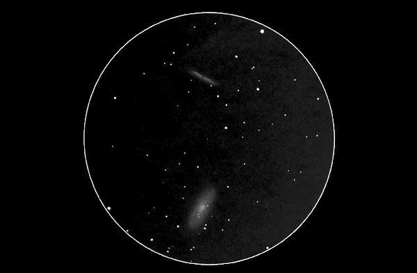 View of M81 and M82 through an 8-inch telescope, 40x magnification. Credit: Michael Vlasov