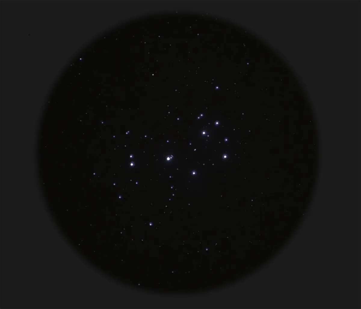 View of the Pleiades through 15x70 binoculars. Credit: Pete Lawrence