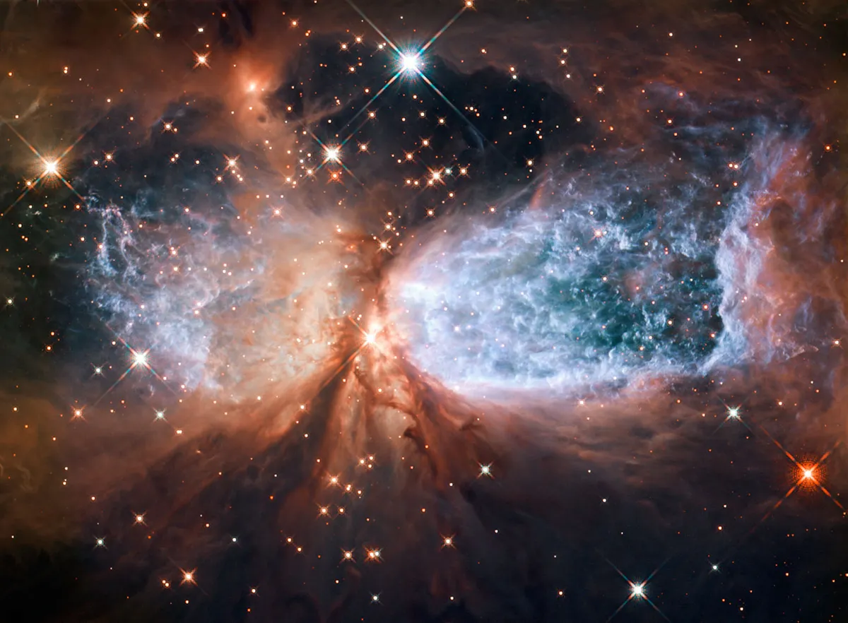 Sh 2-106 15 December 2011. A compact star-forming region in the constellation Cygnus. Newly-formed star S106 IR is shrouded in dust at the centre. Credit: NASA & ESA