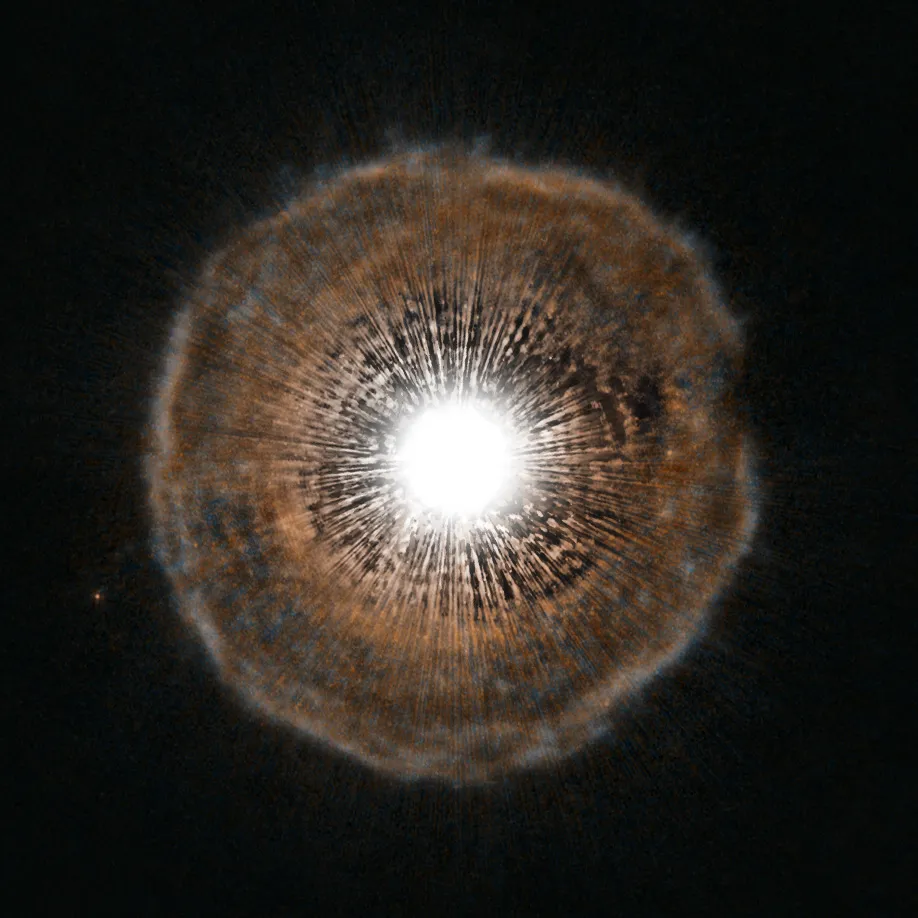 U Camelopardalis 2 July 2012. Star U Camelopardalis is surrounded by a faint bubble of gas. Nearing the end of its life, every few thousand years the star coughs out a spherical shell of gas as a layer of helium around its core begins to fuse. Credit: ESA/Hubble, NASA and H. Olofsson