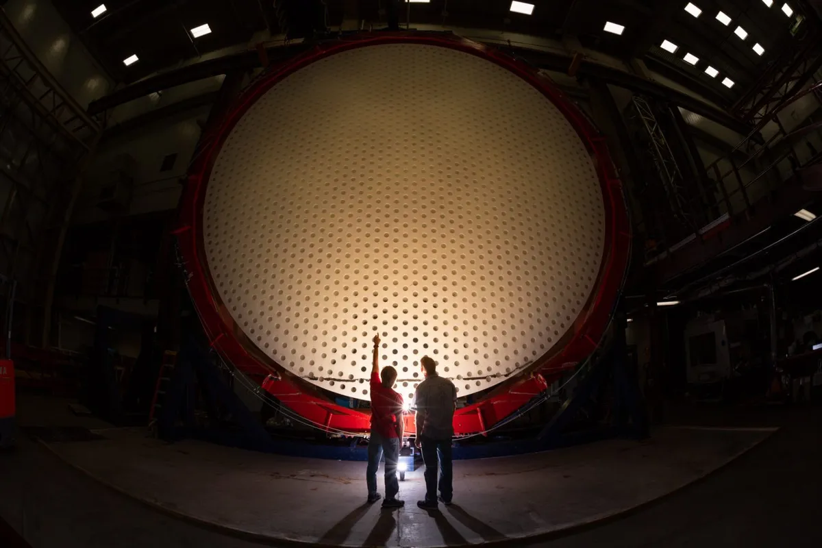 Mirror Lab staff pictured with GMT mirror number 5, April 2019, just before the mirror was moved to the integration hall. Credit: GMTO Corporation