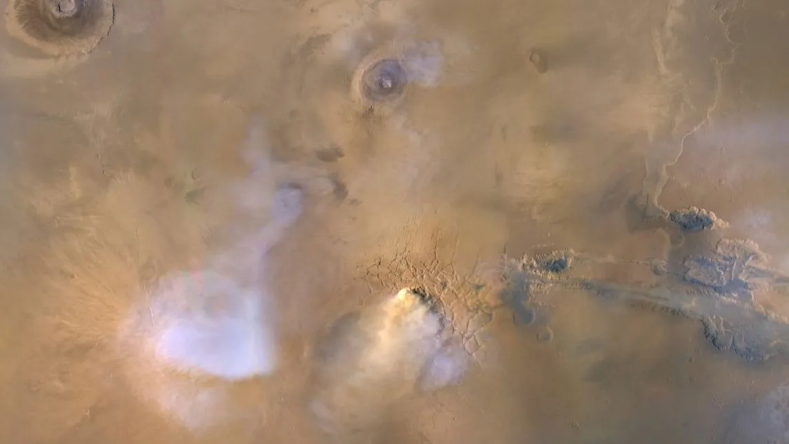 A key danger of the Martian environment is the dust storms that can smother the entire planet. The yellow-white cloud in this image is a 'dust tower', a concentrated cloud of dust that can rise dozens of miles above the surface. This image was captured 30 November 2010 by NASA's Mars Reconnaissance Orbiter. Credit: NASA/JPL-Caltech/MSSS