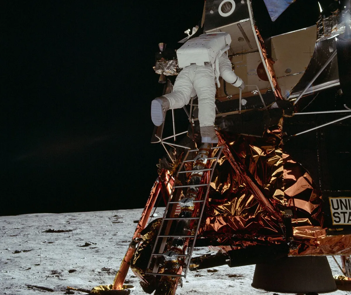 Buzz Aldrin descends the ladder of the Apollo 11 Lunar Module to become the second man on the Moon. Credit: NASA