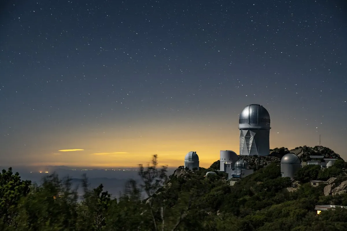 A view of the Mayall Telescope (tallest telescope, right) at Kitt Peak National Observatory near Tucson, Arizona. Credit: Marilyn Chung/Berkeley Lab; © 2010-2019 The Regents of the University of California, Lawrence Berkeley National Laboratory.