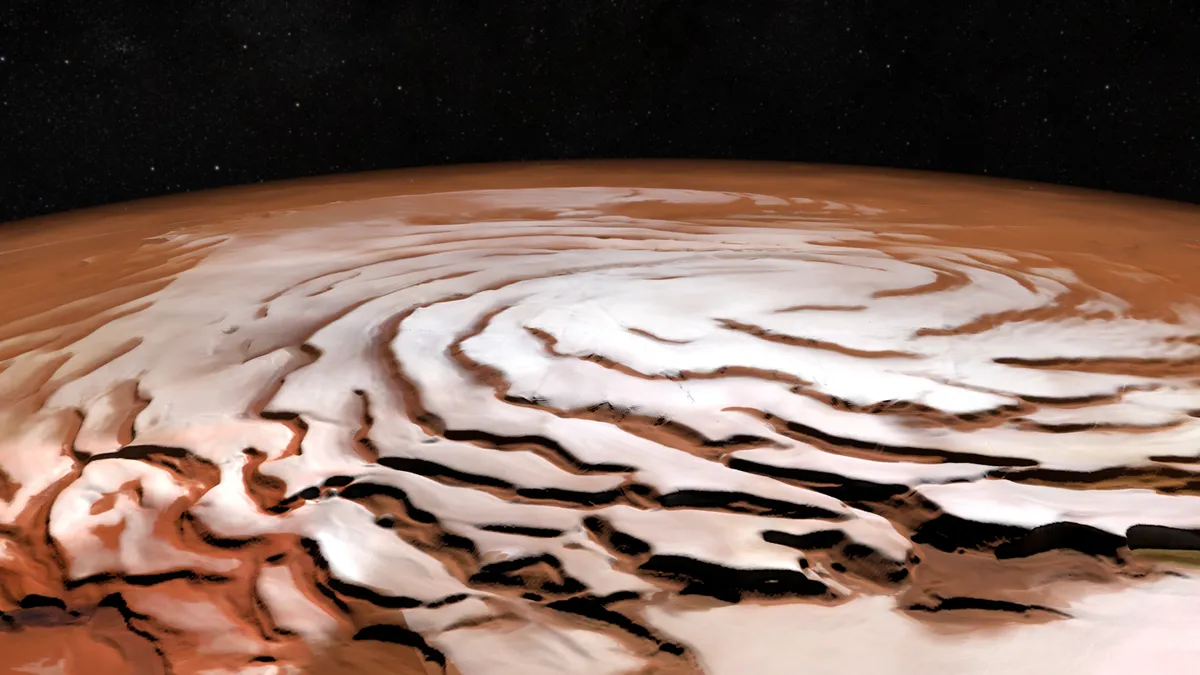 This image shows Mars's north polar ice cap, as seen by ESA's Mars Express orbiter. Credit: ESA/DLR/FU Berlin; NASA MGS MOLA Science Team