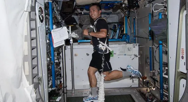 JAXA astronaut Koichi Wakata exercises on the International Space Station's treadmill.