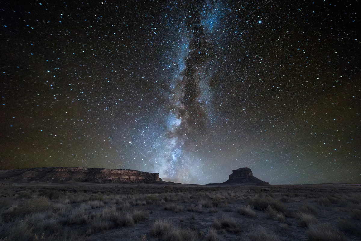 The Milky Way galaxy sets over Fajada Mesa at Chaco Canyon, New Mexico. Credit: Eric Lowenbach / Getty Images