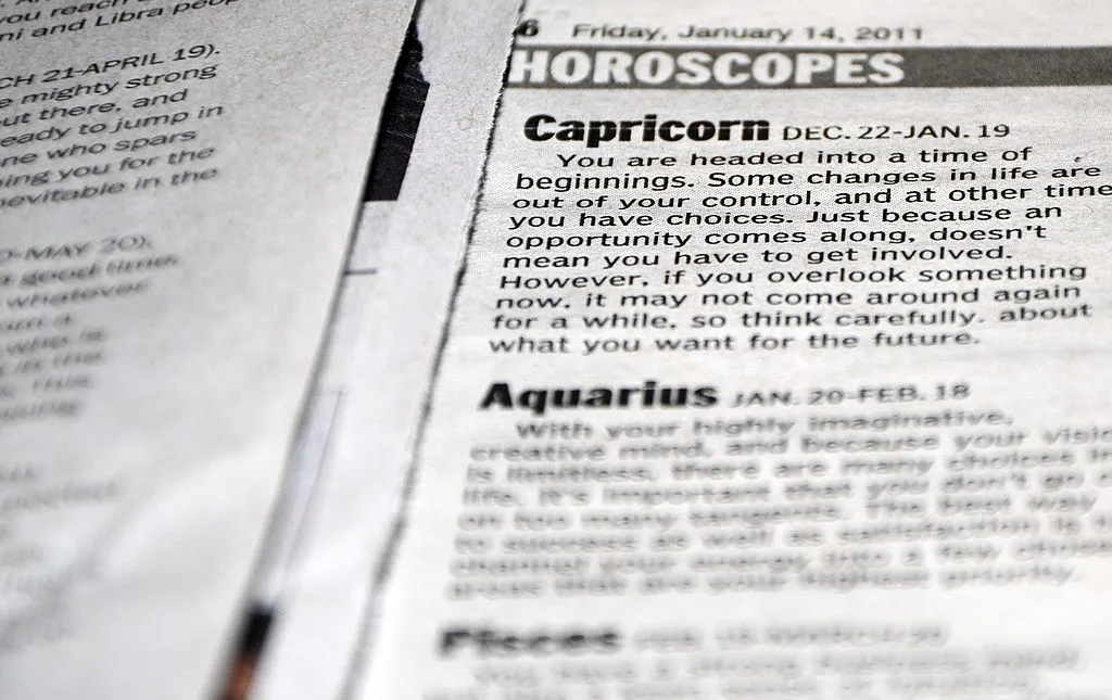 Horoscopes in newspapers are a good example of how astrology has survived in popular culture today. Credit: EVA HAMBACH/AFP via Getty Images
