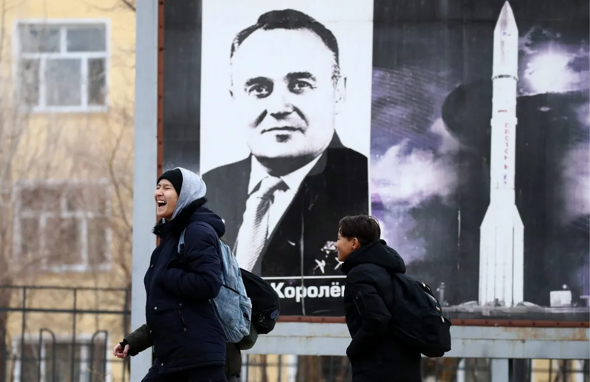 Korolev’s legacy lives on. In the city of Baikonur, Kazakhstan, schoolchildren walk past a street poster portraying Sergei Korolev and his Soyuz rocket. Baikonur Cosmodrome is still the site of Russian Soyuz launches to this day. Photo by Valery SharifulinTASS via Getty Images.