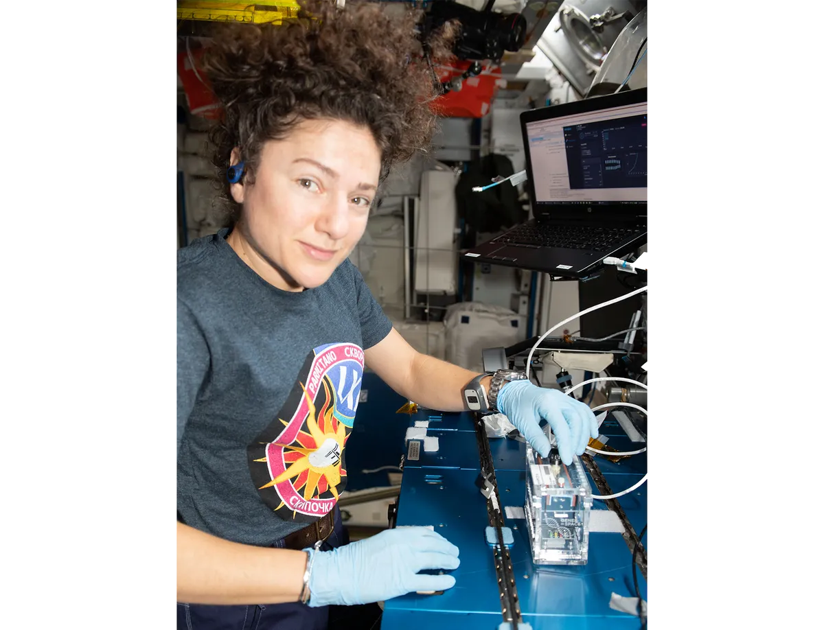 NASA astronaut Jessica Meir prepares DNA samples for sequencing for the Genes in Space-6 experiment. The study explores how cells repair DNA damaged by space radiation to help learn how to protect astronauts on the space station and future missions beyond low-Earth orbit. Credit: NASA