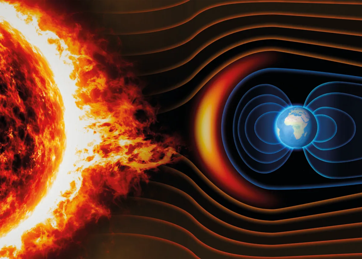 The dynamo effect of the Earth’s spinning molten core produces our planet’s magnetic field, which prevents the solar wind from stripping away our atmosphere. Credit: Naeblys / Getty Images