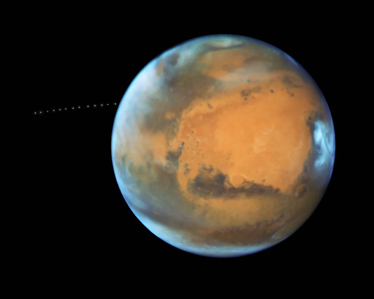A Hubble Space Telescope image of Mars showing the stages of its moon Phobos's orbit. Credit: NASA, ESA and Z. Levay (STScI) Acknowledgment: J. Bell (ASU) and M. Wolff (Space Science Institute)