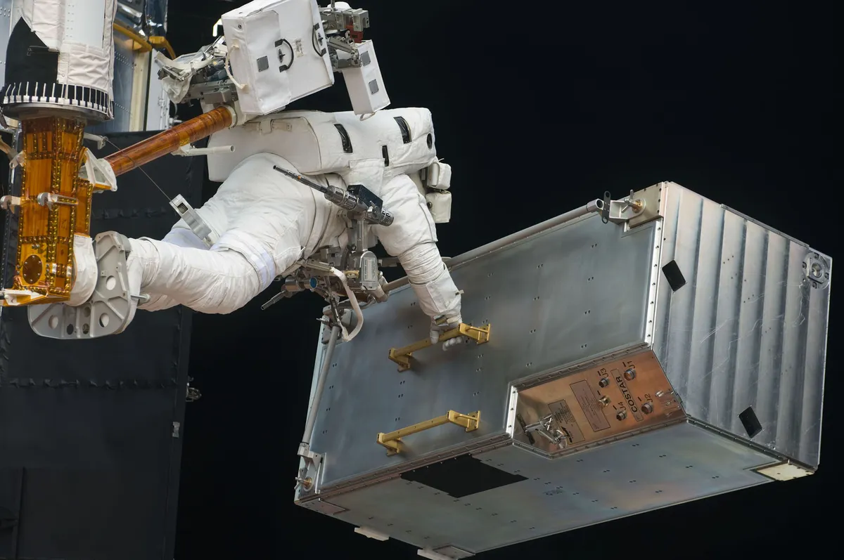 Job done: Hubble’s COSTAR is removed in 2009 to make way for new equipment. Credit: NASA