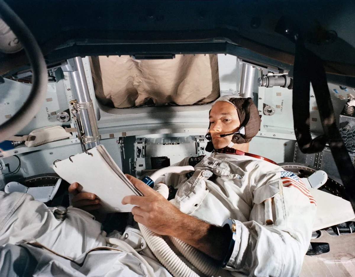 Apollo 11 Command Module Pilot Michael Collins during flight rehearsal in a simulator, June 1969, just a month before liftoff. Left alone in the module orbiting the far side of the Moon while Armstrong and Aldrin explored the lunar surface, Collins experienced isolation like no human being before him. Credit: NASA