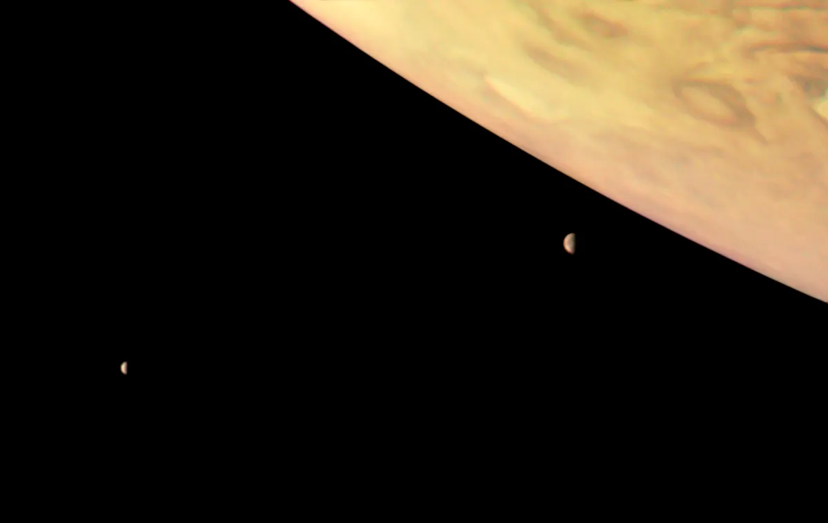 A view of Jupiter and its moons Io and Europa, captured by NASA's Juno spacecraft. Can you spot its fainter moons? Image Credit: NASA/JPL-Caltech/SwRI/MSSS/Roman Tkachenko