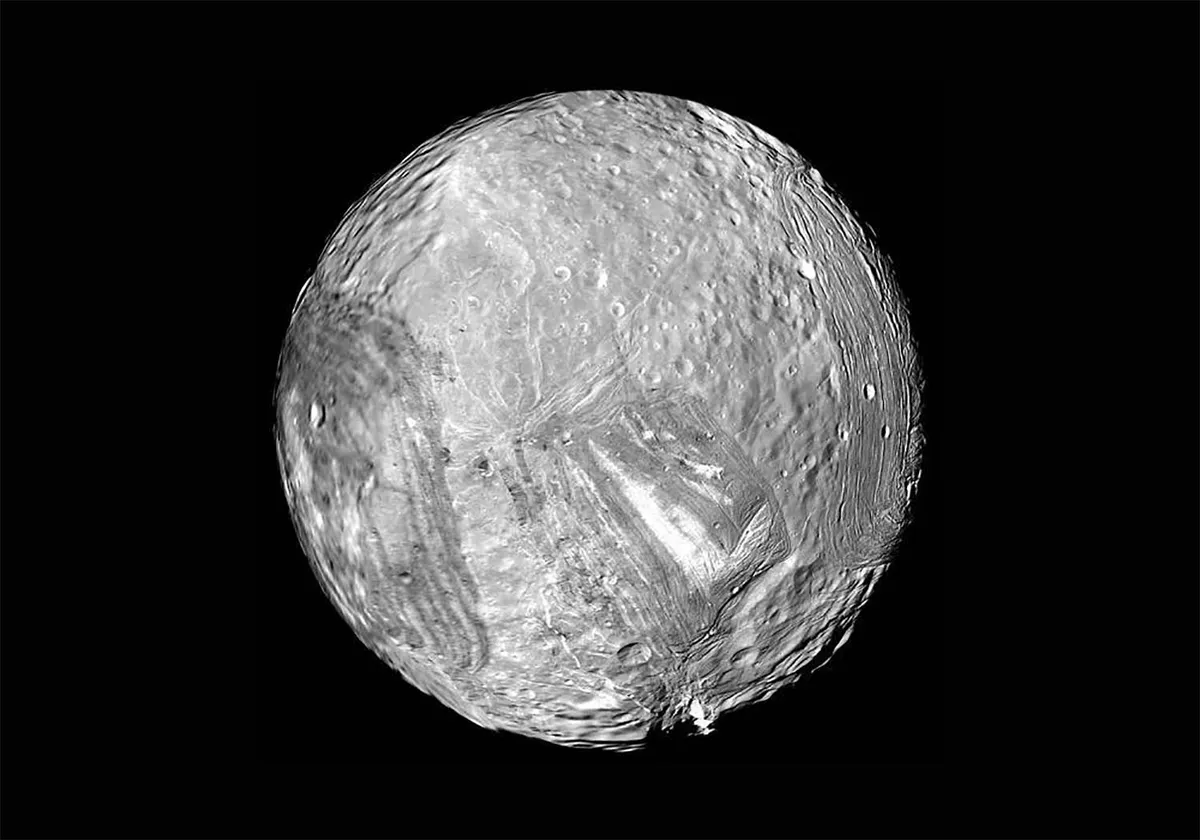 Uranus's moon Miranda appears fractured in this image captured by the Voyager 2 spacecraft. Credit: NASA/JPL-Caltech