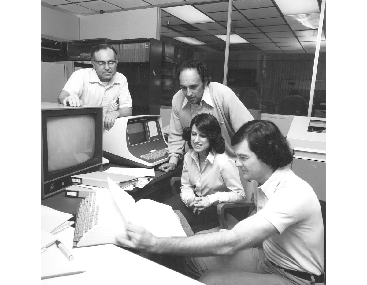 Joe Donegan, Ed Travers, Linda Morabito and Steve Synnott in the navigation team’s image processing room, where the discovery of active volcanism on Io took place. Credit: NASA