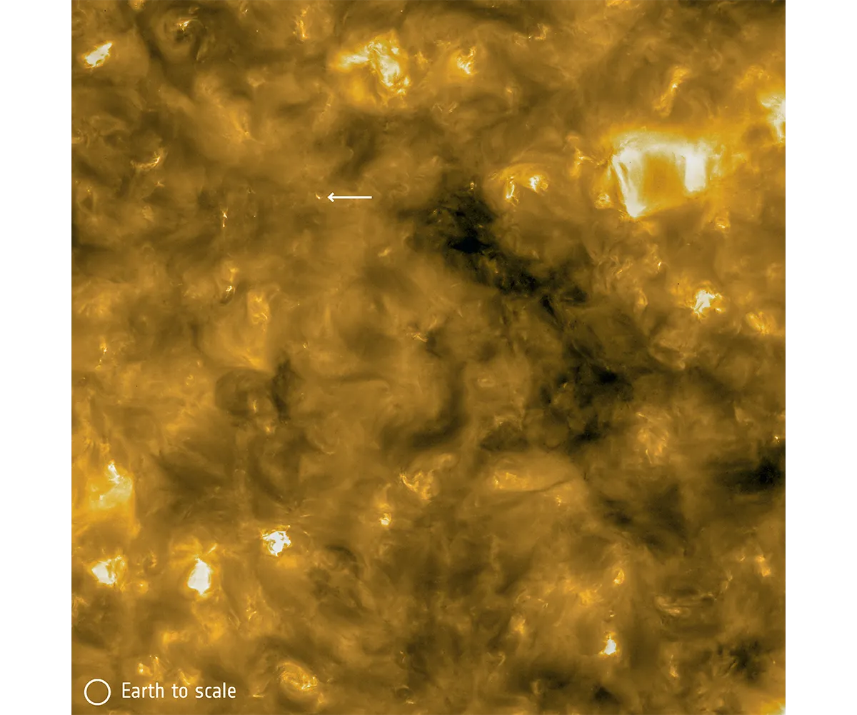 A 'campfire', indicated by the white arrow, seen on the surface of the Sun. Credit: Solar Orbiter/EUI Team/ESA & NASA; CSL, IAS, MPS, PMOD/WRC, ROB, UCL/MSSL