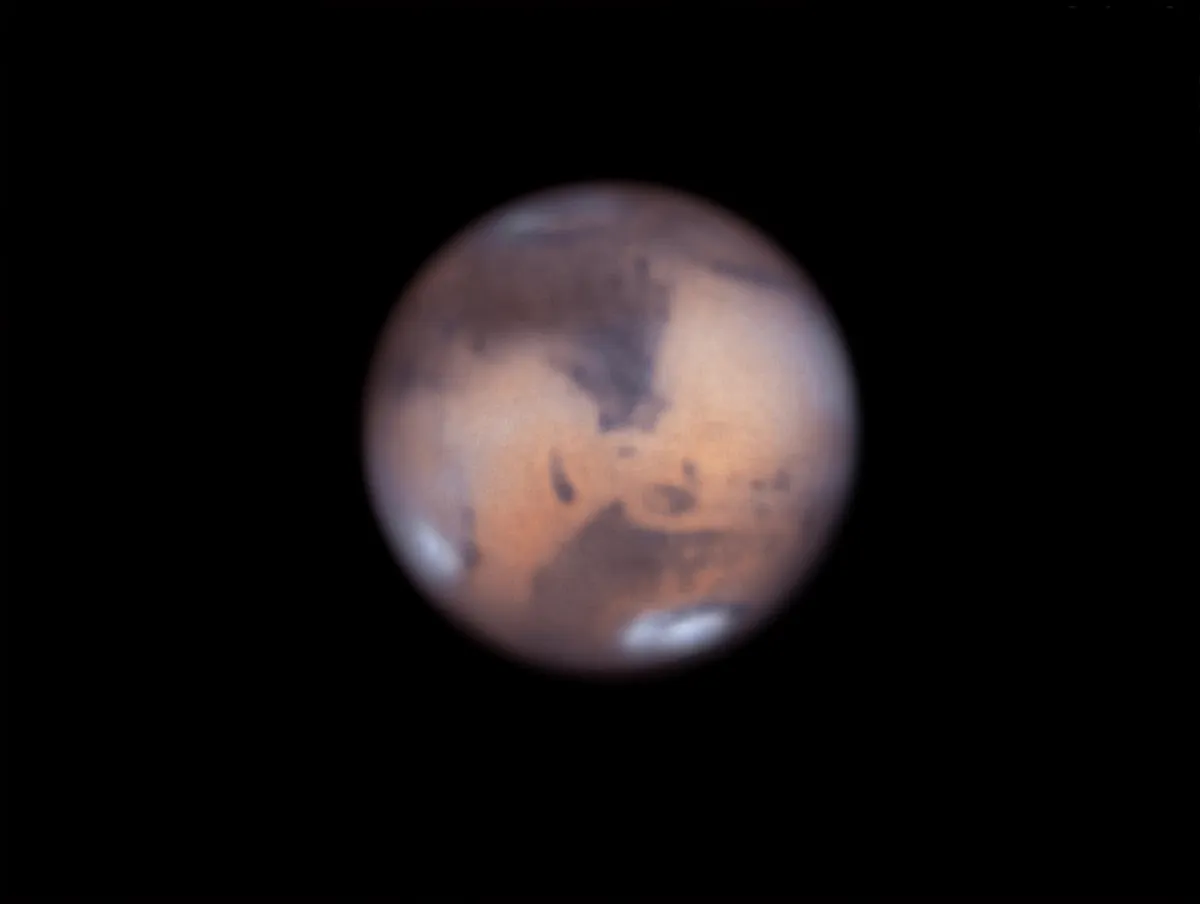 The triangular Syrtis Major can be seen in centre of this image of Mars. Note: south is up in the image. Credit: Pete Lawrence