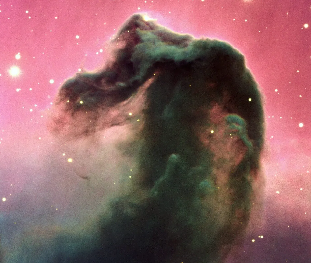 Against the red glow of the Orion Molecular cloud is a dark curl of dust that forms the unmistakable shape of a horse’s head. The larger cloud is a giant stellar nursery, and it’s thought the Horsehead Nebula has enough mass to create 30 Sun-like stars. Credit: ESO