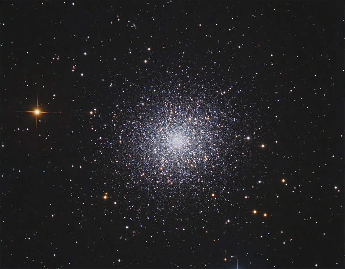 Light from the Hercules globular cluster takes 23,000 lightyears to reach Earth. Credit: Manfred Wasshuber. / CCDGuide.com