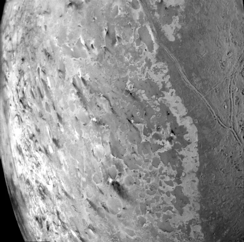 A view of Triton's South Pole, as seen by Voyager 2. About 50 dark plumes could be ice volcanoes erupting. Credit: NASA/JPL