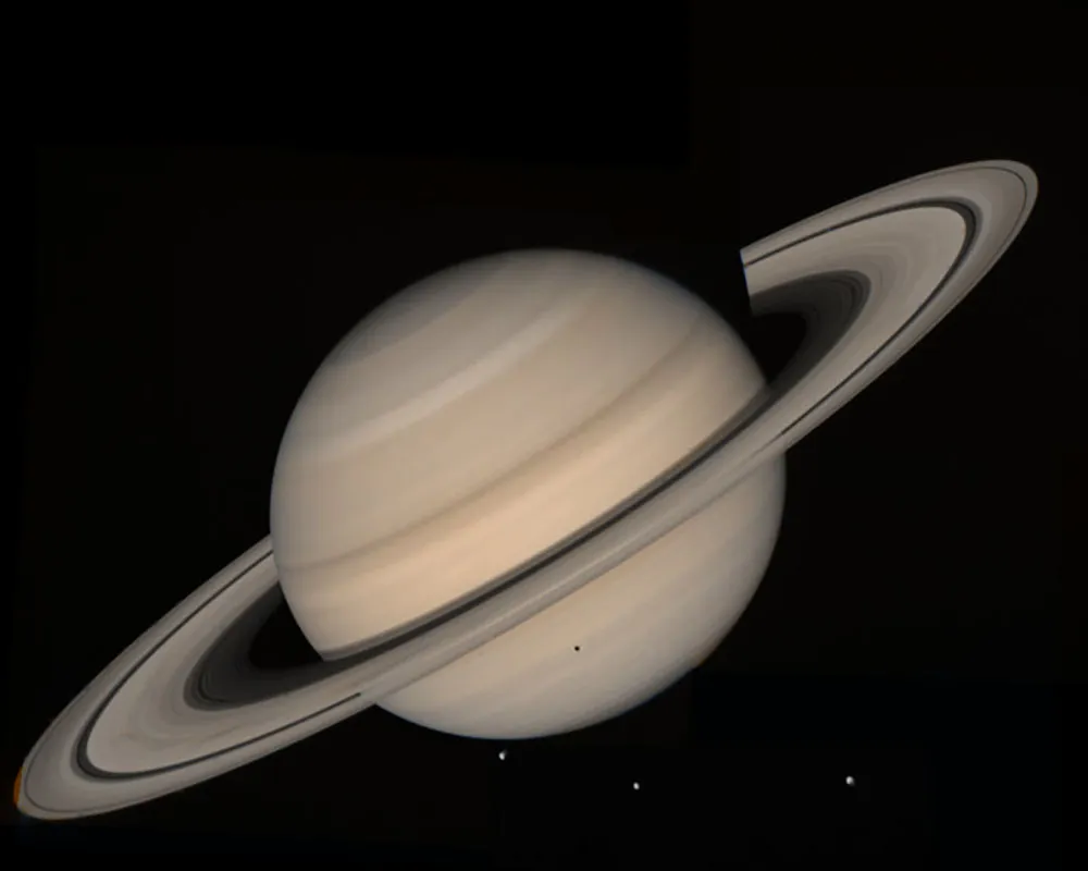 Saturn and its moons Tethys, Dion and Rhea, as seen by Voyager 2 in August 1981. Credit: NASA/JPL-Caltech