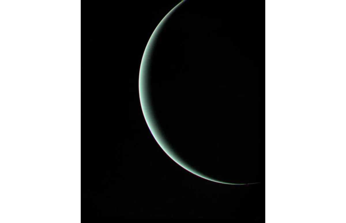 A crescent Uranus is Voyager 2's parting shot as its encounter at the icy giant ends, 25 January 1986. Credit: NASA/JPL-Caltech