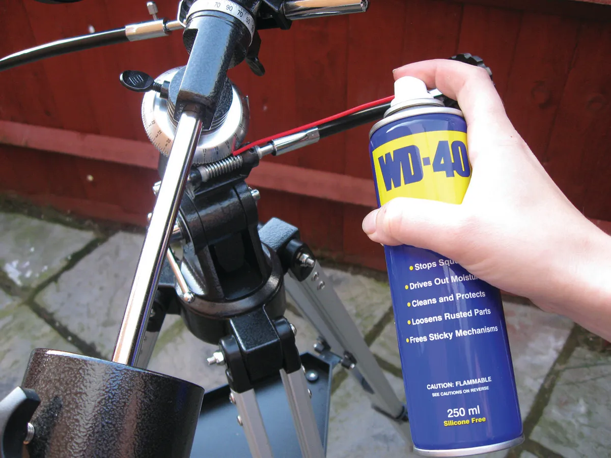 A spray such as WD-40 shifts old grease from your telescope mount and protects parts from moisture. Credit: Anton Vamplew
