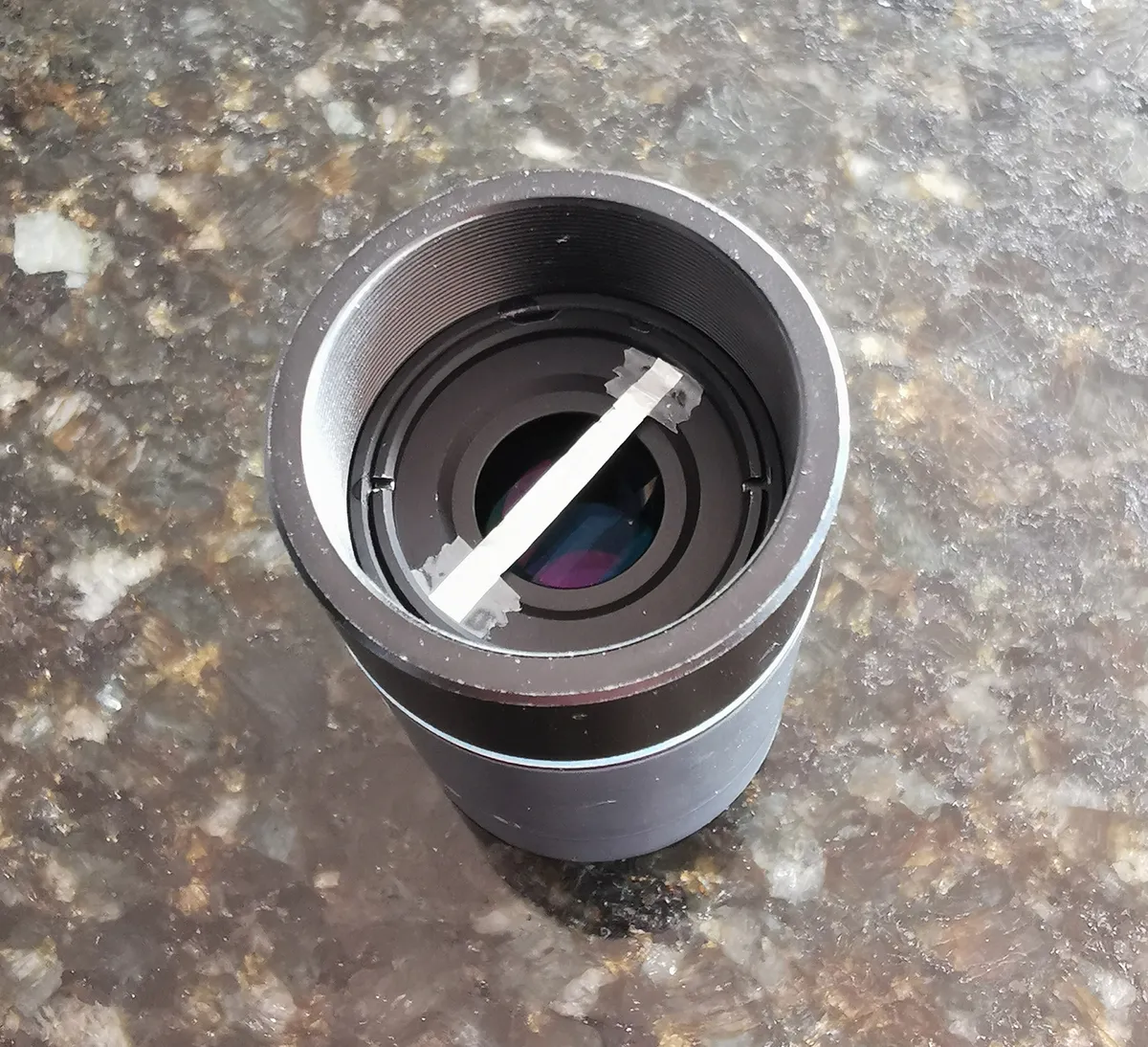 Use an occulting bar, a strip of aluminium foil attached at the focal plane of the eyepiece, to help you hide Mars and see its moons. Credit: Pete Lawrence