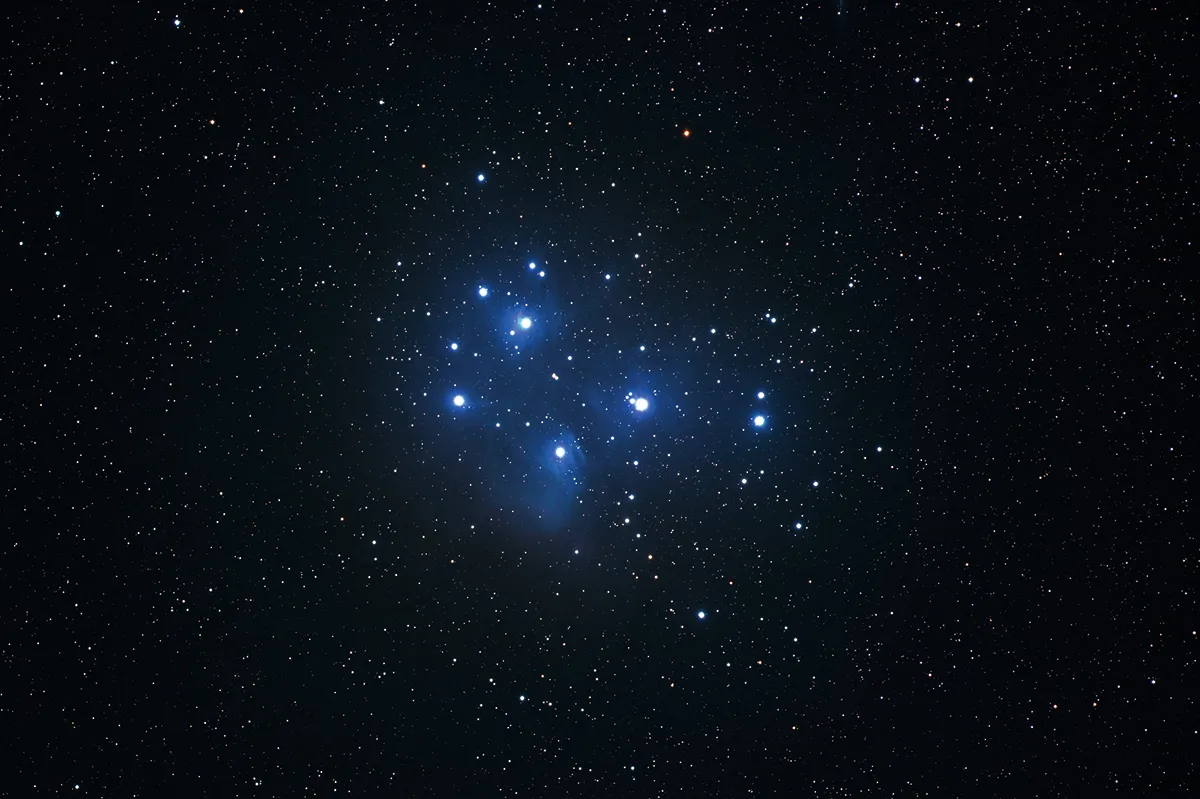 Through a Cassegrain telescope, the Pleiades star cluster appears back to front . Credit: Pete Lawrence