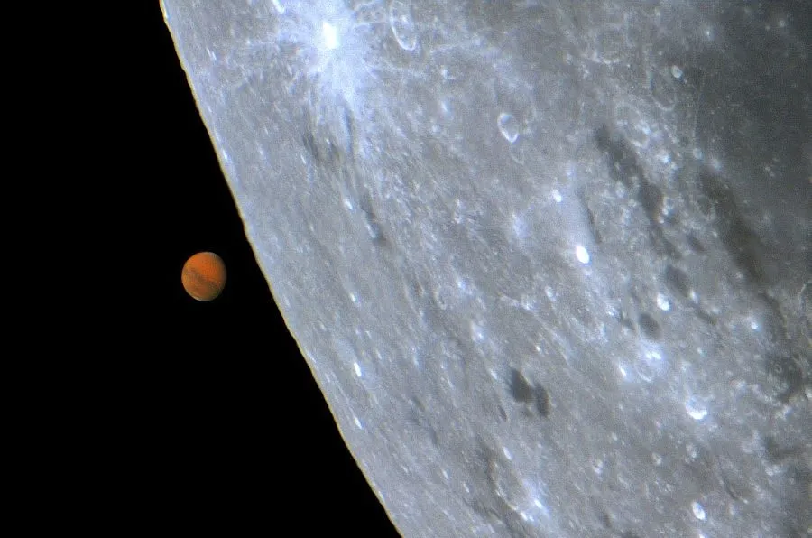The Moon occulting Mars, captured by Ricardo J. Vaz Tolentino, Belo Horizonte, Brazil, 6 September 2020. Will future astrophotographers be able to capture Earth occulting the Moon?