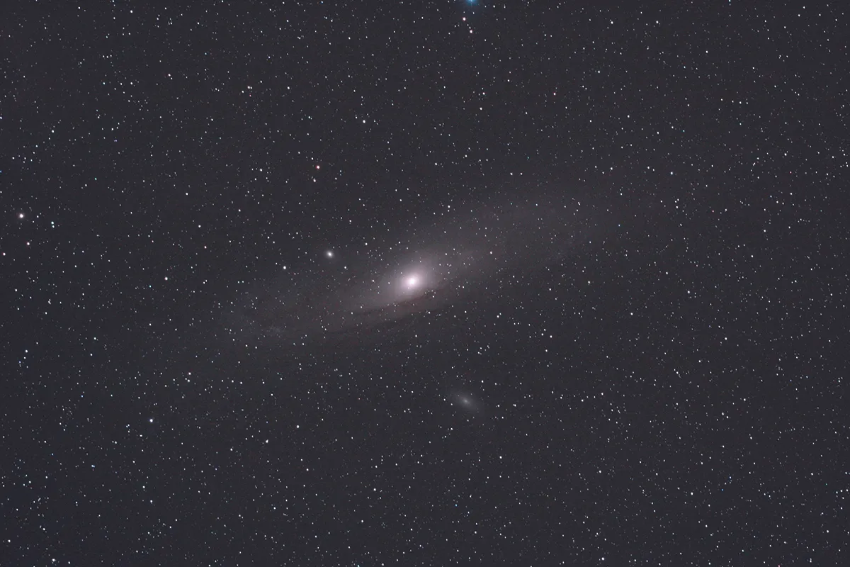 A DSLR can easily capture the elliptical smudge of M31, as well as satellite galaxies M32 and M110. Credit: Pete Lawrence