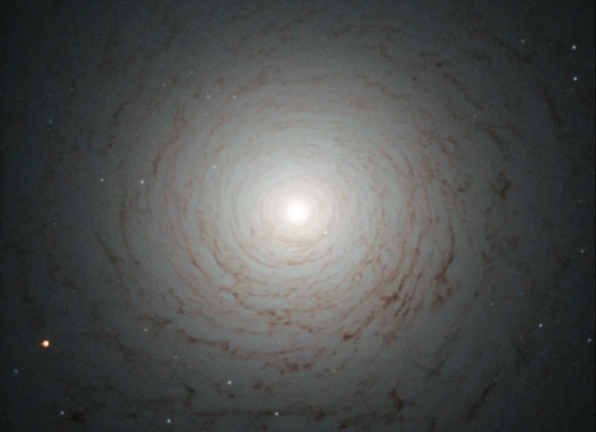 NGC 524 is a lenticular galaxy. Lenticular galaxies are thought to be an intermediate state in galactic evolution, as they are neither elliptical nor spiral. Credit: ESA/Hubble & NASA Acknowledgement: Judy Schmidt