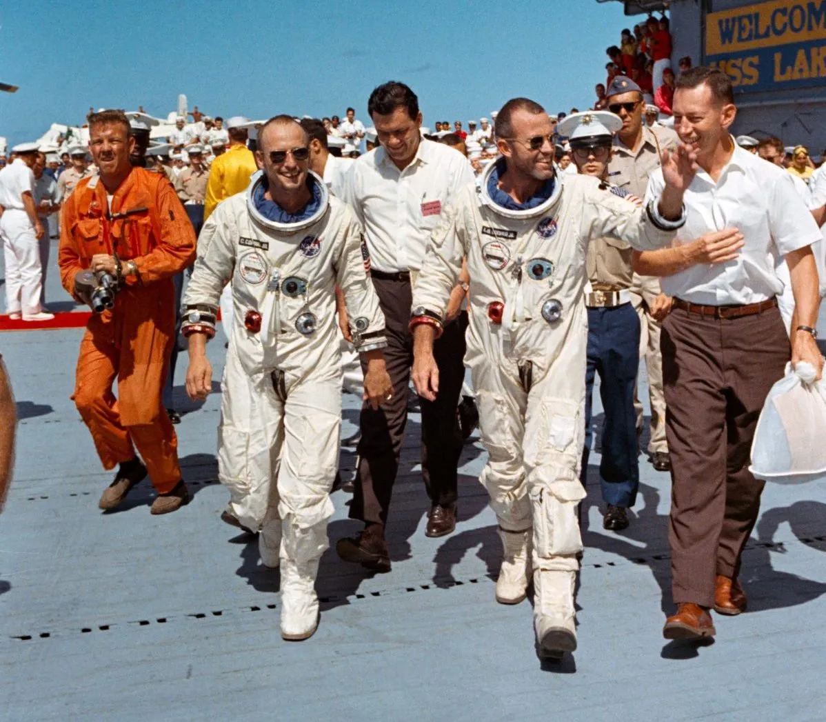 Gemini V command pilot Gordon Cooper (right) and pilot Pete Conrad following the successful recovery of their spacecraft from the ocean, 29 August 1965. Credit: NASA